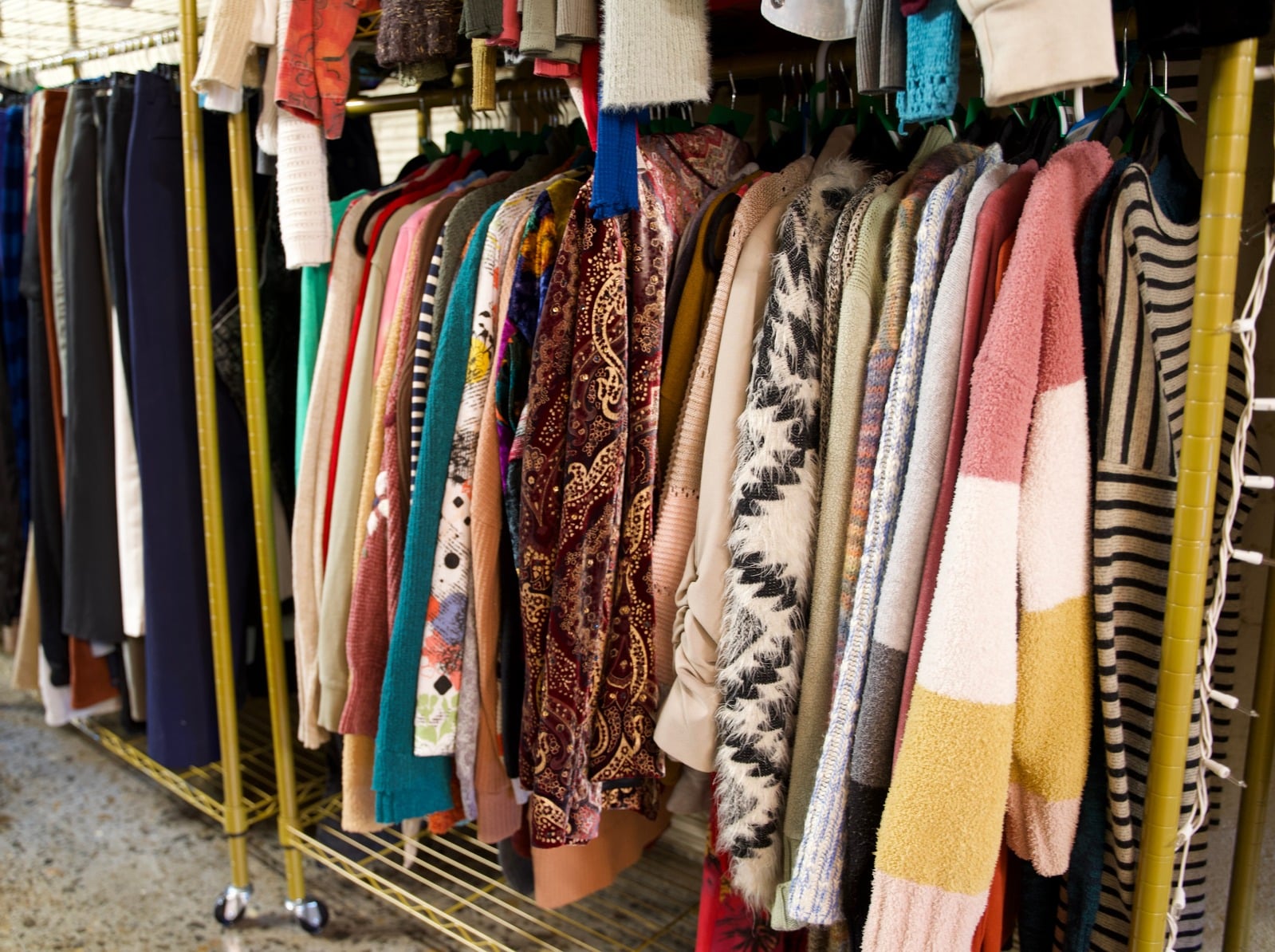 A colorful selection of clothing on racks at the Closetorium